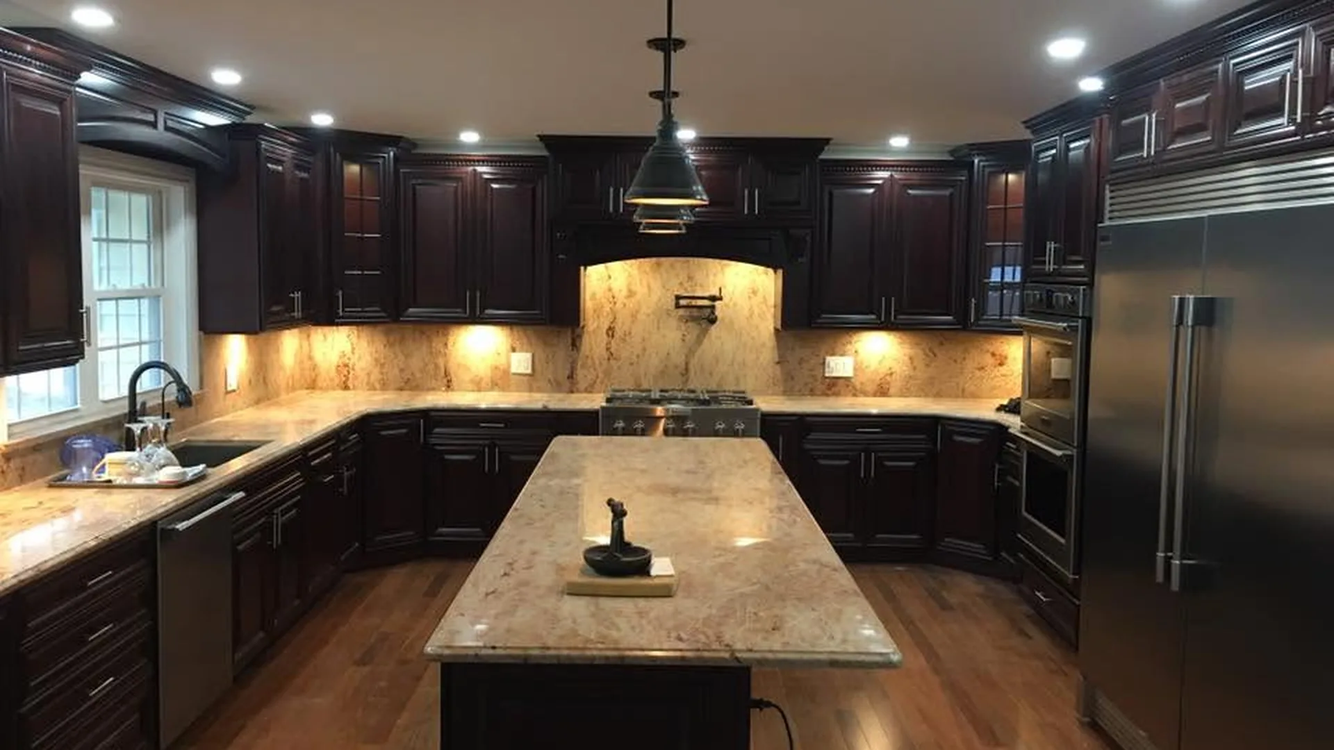 Custom kitchen by North South Construction — cherry cabinetry and granite countertops
