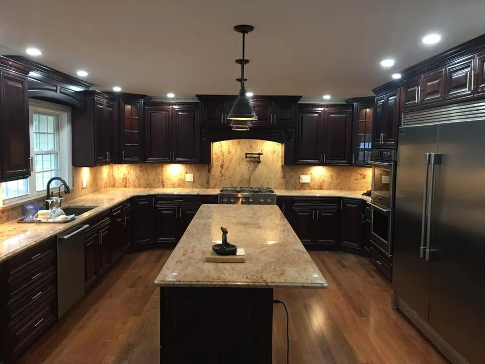 Cherry cabinet kitchen remodel with granite island by North South Construction