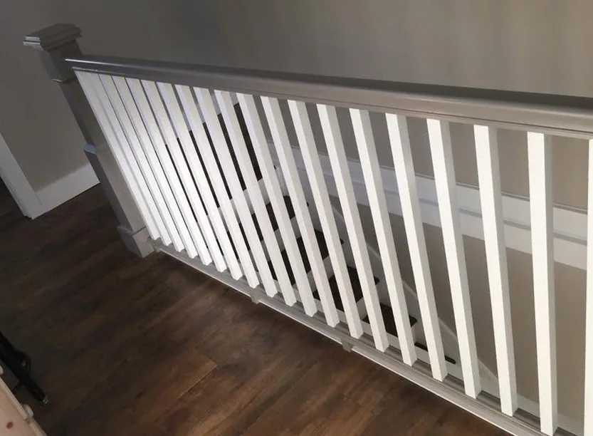 Custom staircase banister and railing by North South Construction